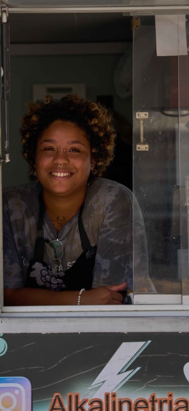 A woman is smiling at the camera.